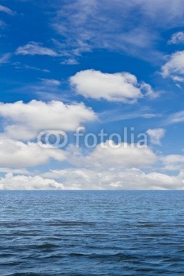 Still sea and blue sky with white cloud for background