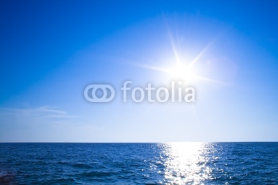 Sun, blue sky and ocean
