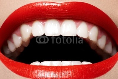 Close-up happy female smile with healthy white teeth