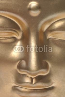 A golden buddha close up.