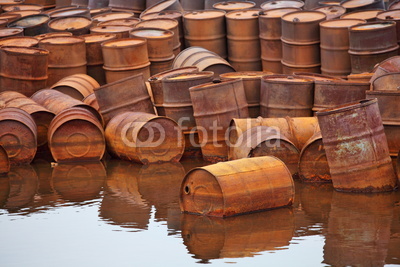 Rusty fuel and chemical drums on Arctic coast