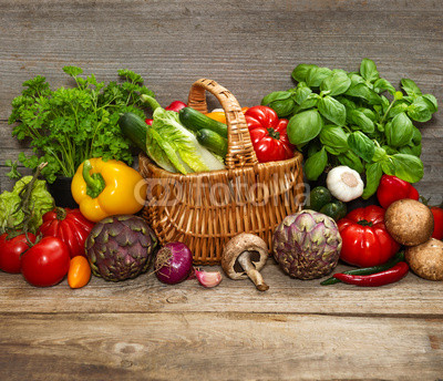 vegetables and herbs on wooden background