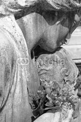 child in mother's arms - cemetery statue