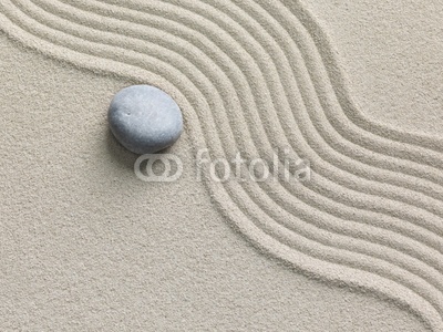 Zen stone in the sand