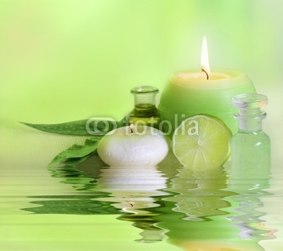 Fresh spa arrangement with candle and essential oil