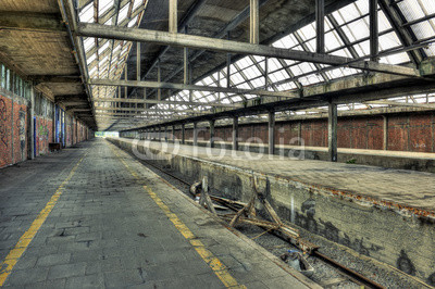 Abandoned platform at a derelict railway station