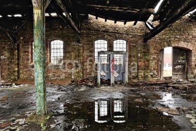 Smashed toilets in a derelict warehouse
