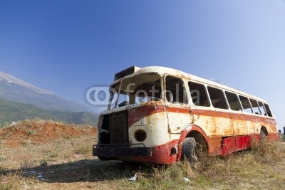 bus wreck in arid landscape