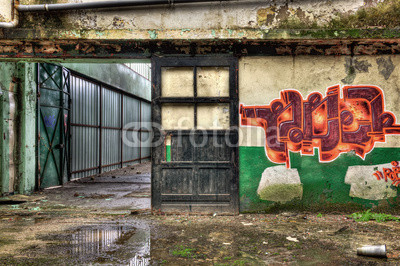 Wooden door inside an old derelict warehouse