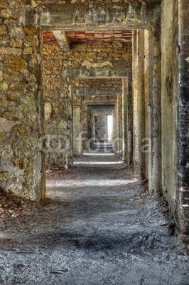 Long empty corridor and doors in abandoned building