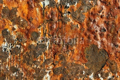 Rust and fuel streaks on an old derelict oil tank